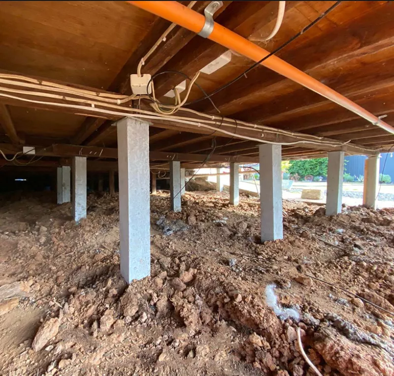 Row of new concrete stumps supporting a timber floor – restumping in Anglesea