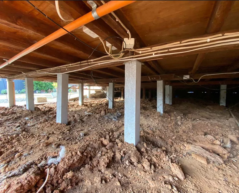 Concrete stumps supporting a house subfloor after reblocking – underpinning and reblocking in Lorne