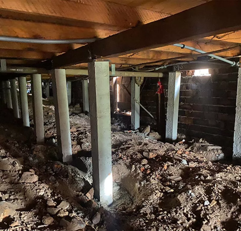 Rows of new concrete stumps in an excavated subfloor – restumping in Lorne