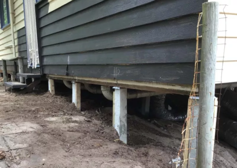 Weatherboard house raised on new stumps during reblocking – underpinning and reblocking in Lorne